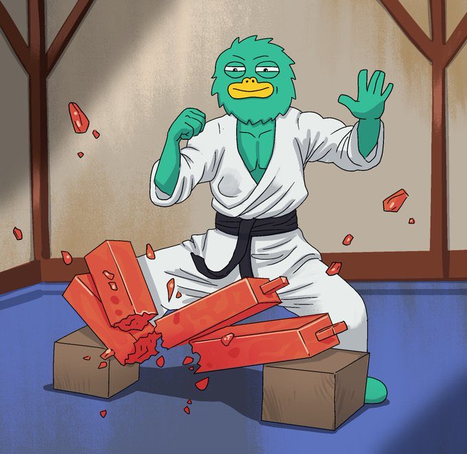 Karate Yeti smashing bricks in a white gi